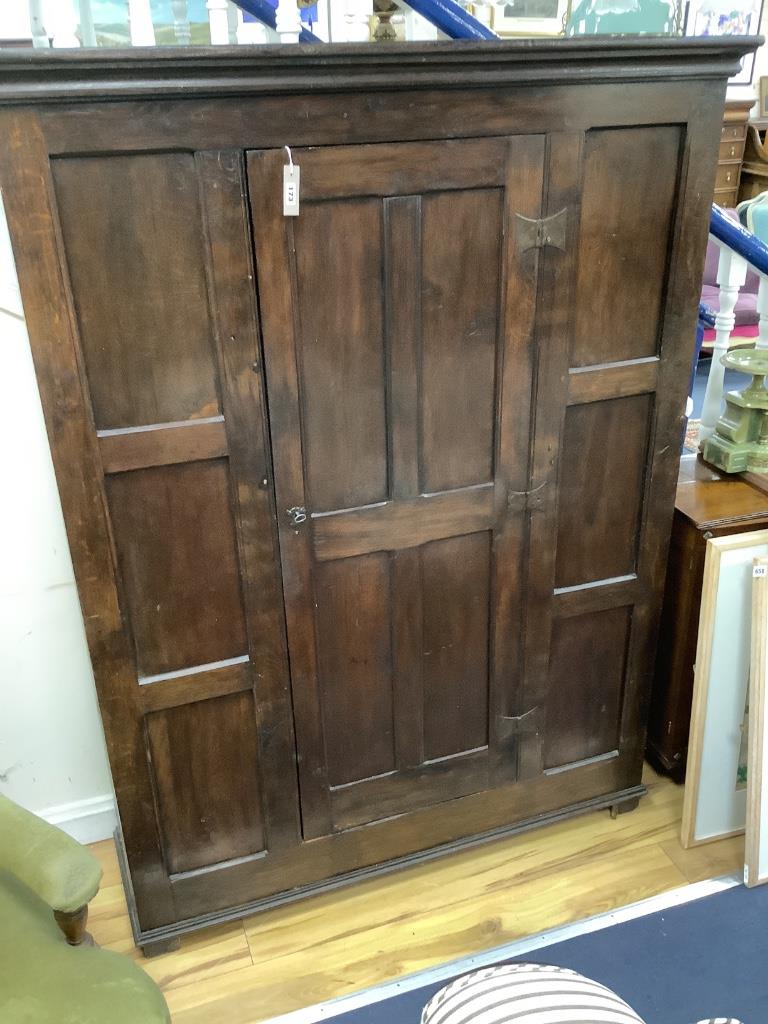 An 18th century and later panelled oak cabinet, width 130cm, depth 40cm, height 173cm